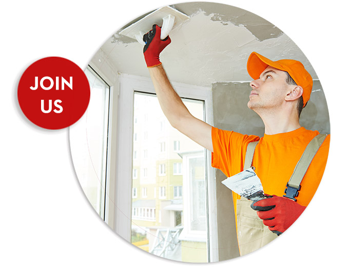 Plasterer at indoor ceiling work