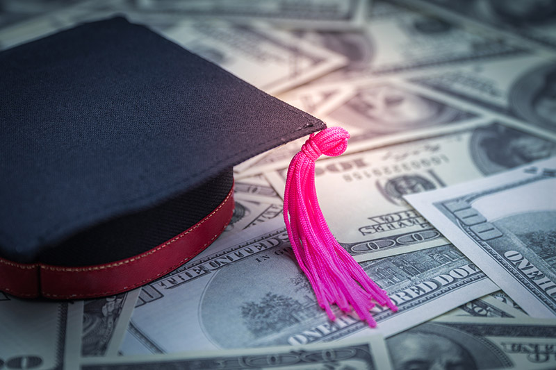Graduation cap one hundred dollar bills